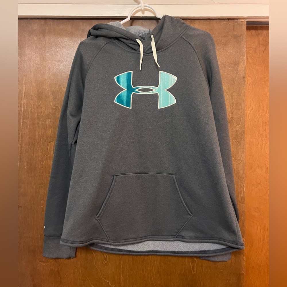 Women’s under armor hoodie, fuzzy lined. Drawstring on hood. Storm 1